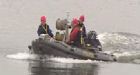 Divers pull 2 bodies from Quebec lake after helicopter crash